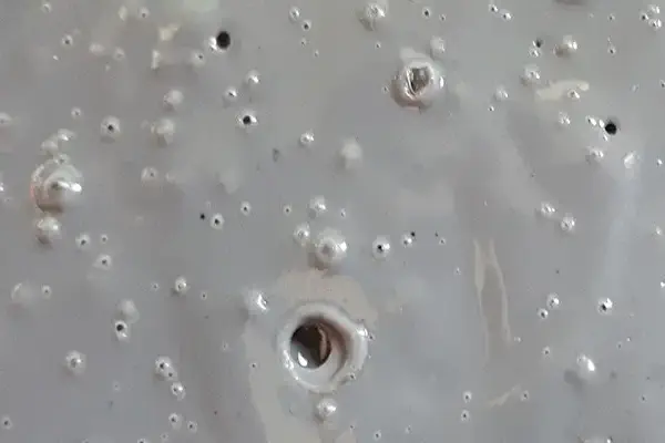 Why do pure polyester powder coatings have bubbles